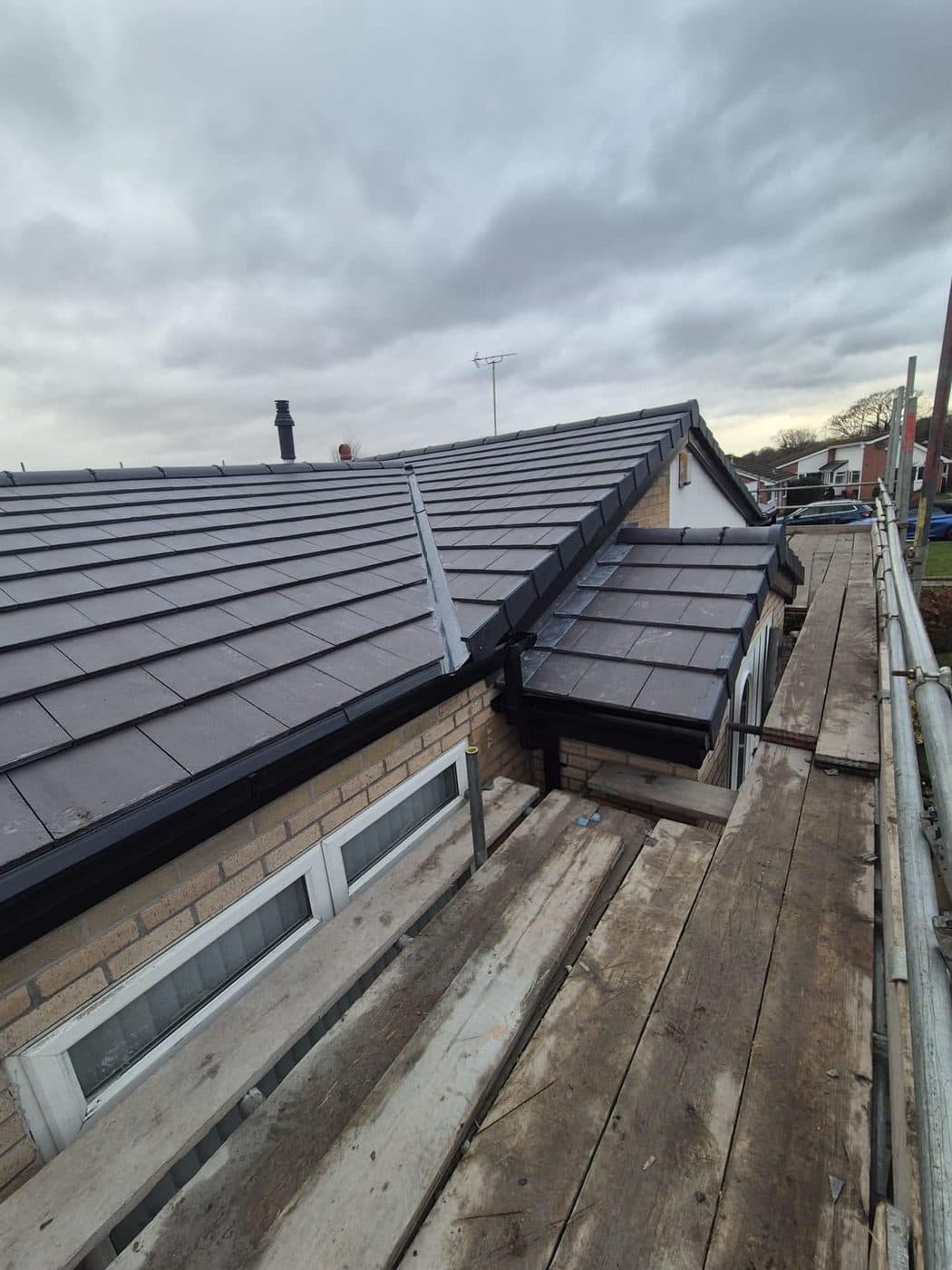 New black uPVC fascias and guttering on a bungalow re-roof, Parkgate