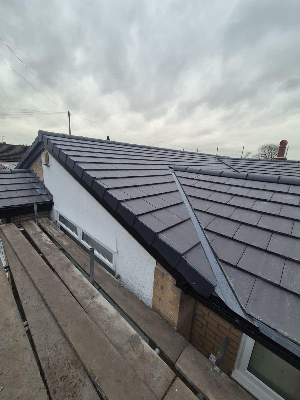 Completed new bungalow roof in grey concrete interlocking tiles, Parkgate, Wirral